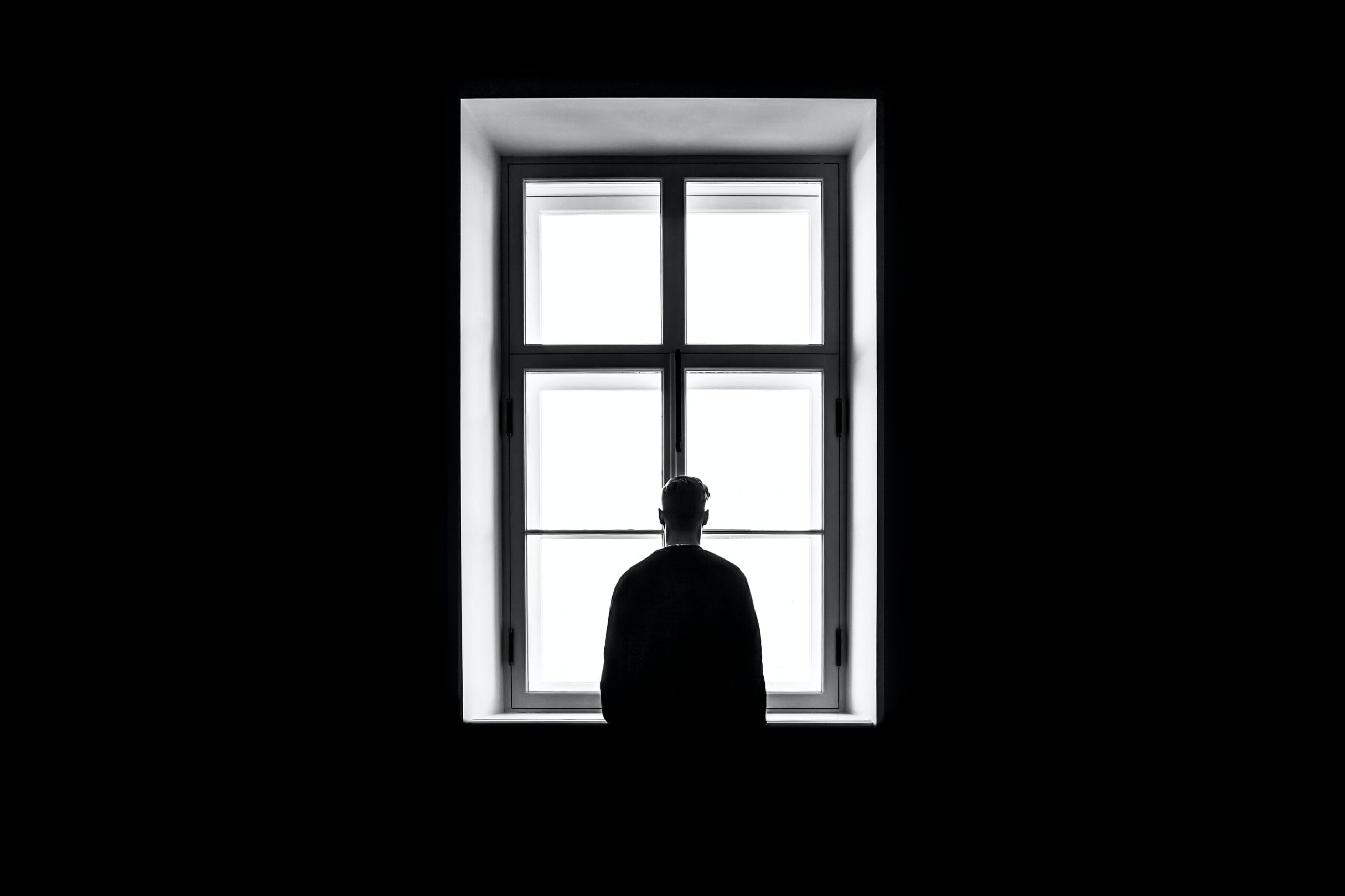 man looking out of the window